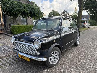Vaurioauto  passenger cars Mini 1000 U9 OPKNAPPER 1990/3